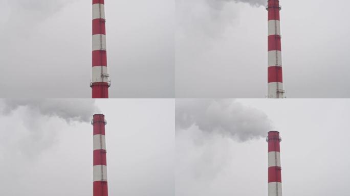 工作管顶着灰蒙蒙的天空，空气污染，环境灾难，向上移动