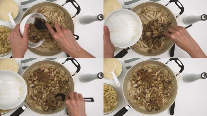 油炸切碎的奇琴肉和油炸切碎的白蘑菇放在煎锅上，平放，混合配料