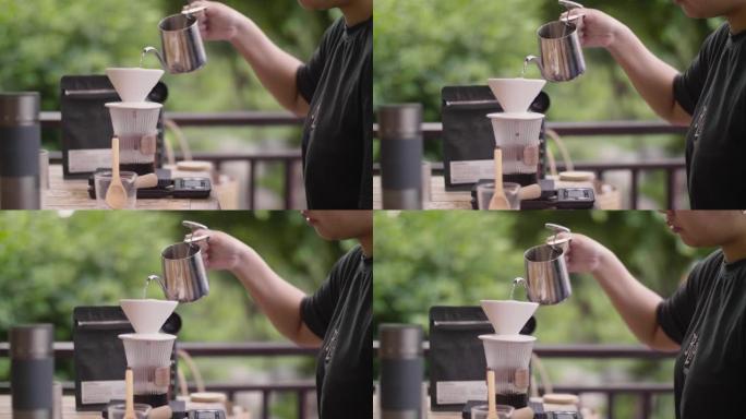 将热水倒入滴头以制作手滴咖啡。