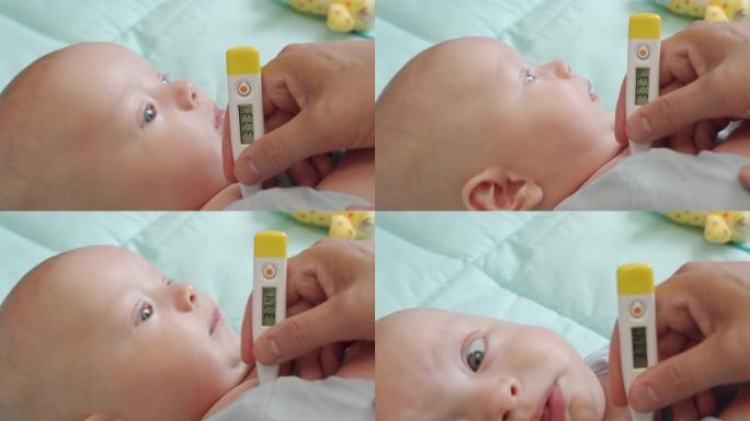 母亲用数字温度计测量婴儿体温，测量一个三个月大男婴的腋下温度，温度计显示温度上升。