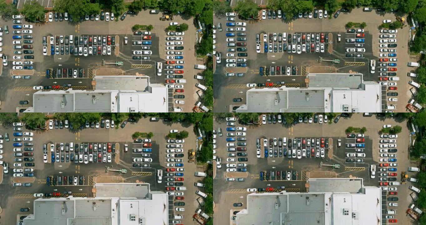 购物中心附近的大型停车场从停车场的空中有汽车
