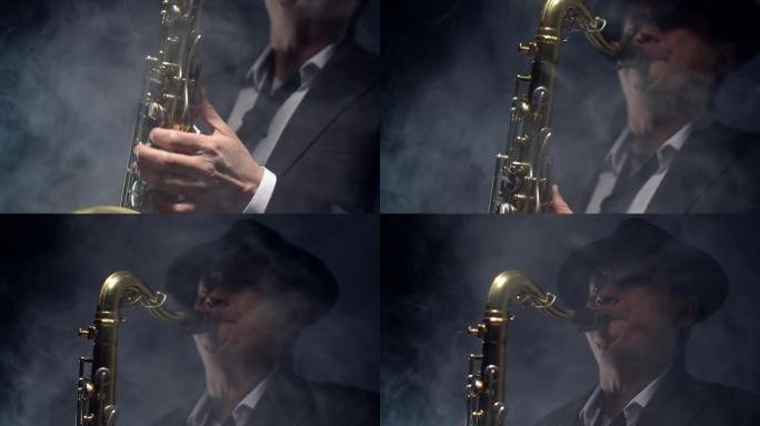 穿着帽子和西装的男性音乐家拿着金色萨克斯管，吹着话筒的烟雾。表演者演奏萨克斯管，交响乐团。演奏乐器的