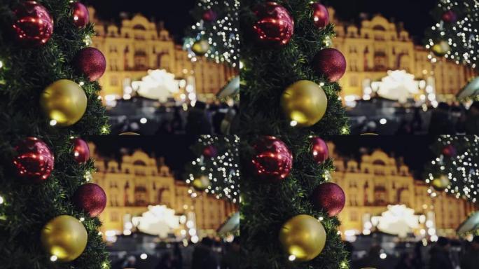 布拉格晚景照明背景建筑上的圣诞树冷杉树枝。选择性聚焦
