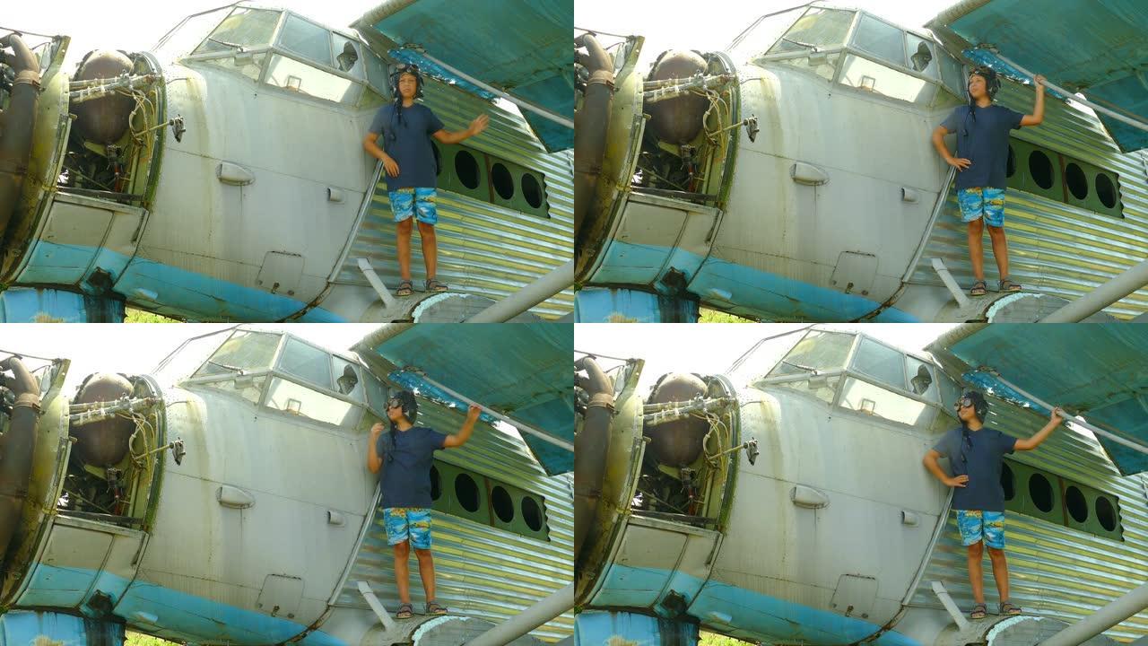 男孩在一架被摧毁的旧飞机上玩耍