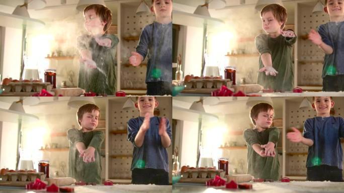 两个小男孩在厨房里玩面粉。