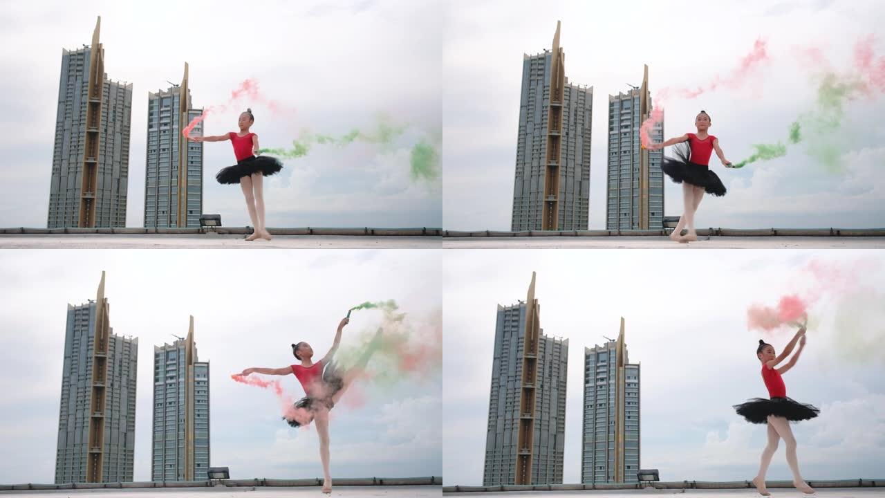 红色连衣裙和黑色裙子的芭蕾舞女孩在高层建筑的屋顶或露台上跳舞，粉色和绿色的烟雾