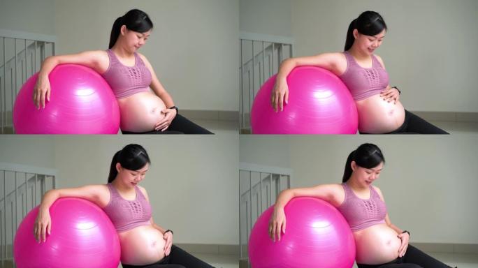 亚洲孕妇用瑜伽球锻炼
