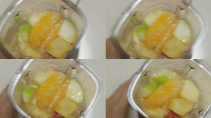SLO MO混合水果冰沙在罐子里混合。
