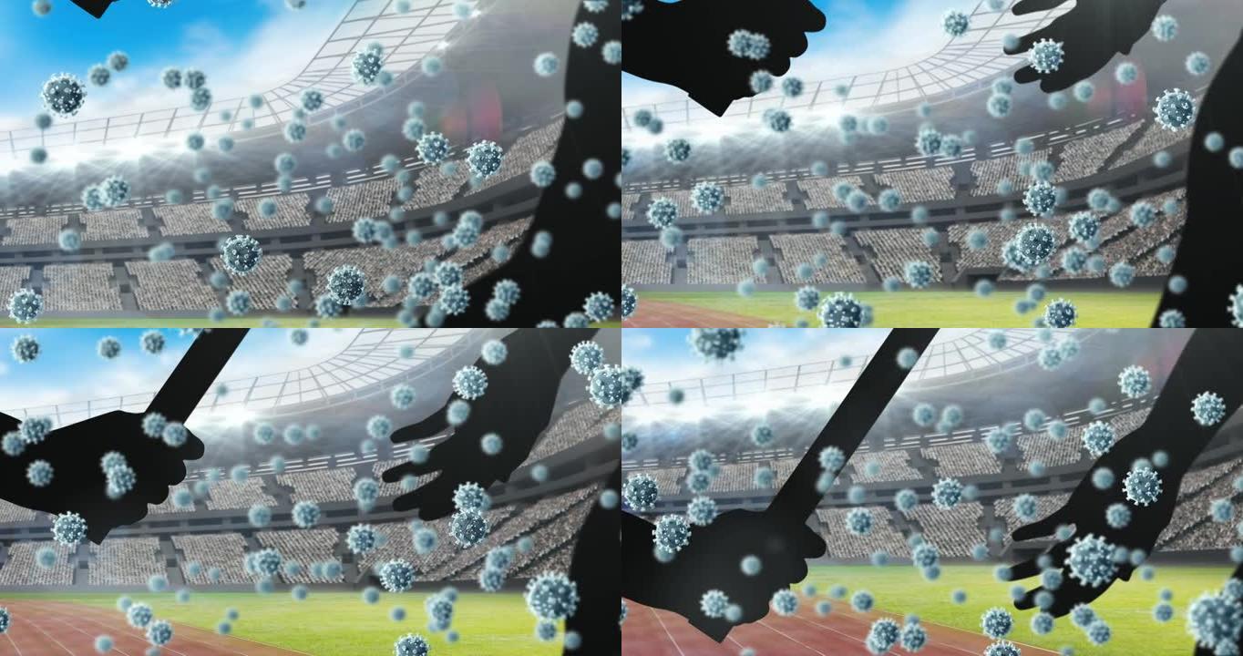 新型冠状病毒肺炎细胞漂浮在手边的轮廓上，通过接力棒对着体育馆