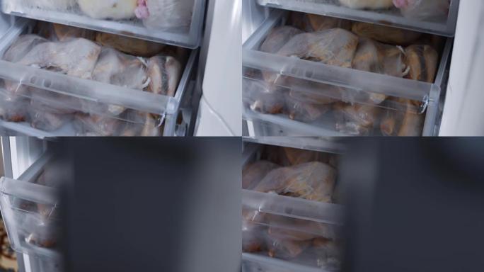 肉类储备，新型冠状病毒肺炎大流行期间的肉类储备。鸡肉储存和放在冰箱里。4k视频