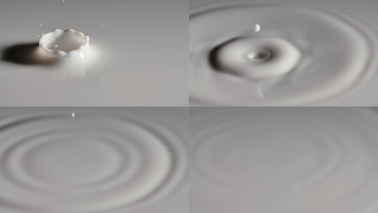 一滴牛奶落在白色液体的表面，产生波纹波，形成美丽的皇冠飞溅。滴滴牛奶有波纹和圆圈，慢动作。特写