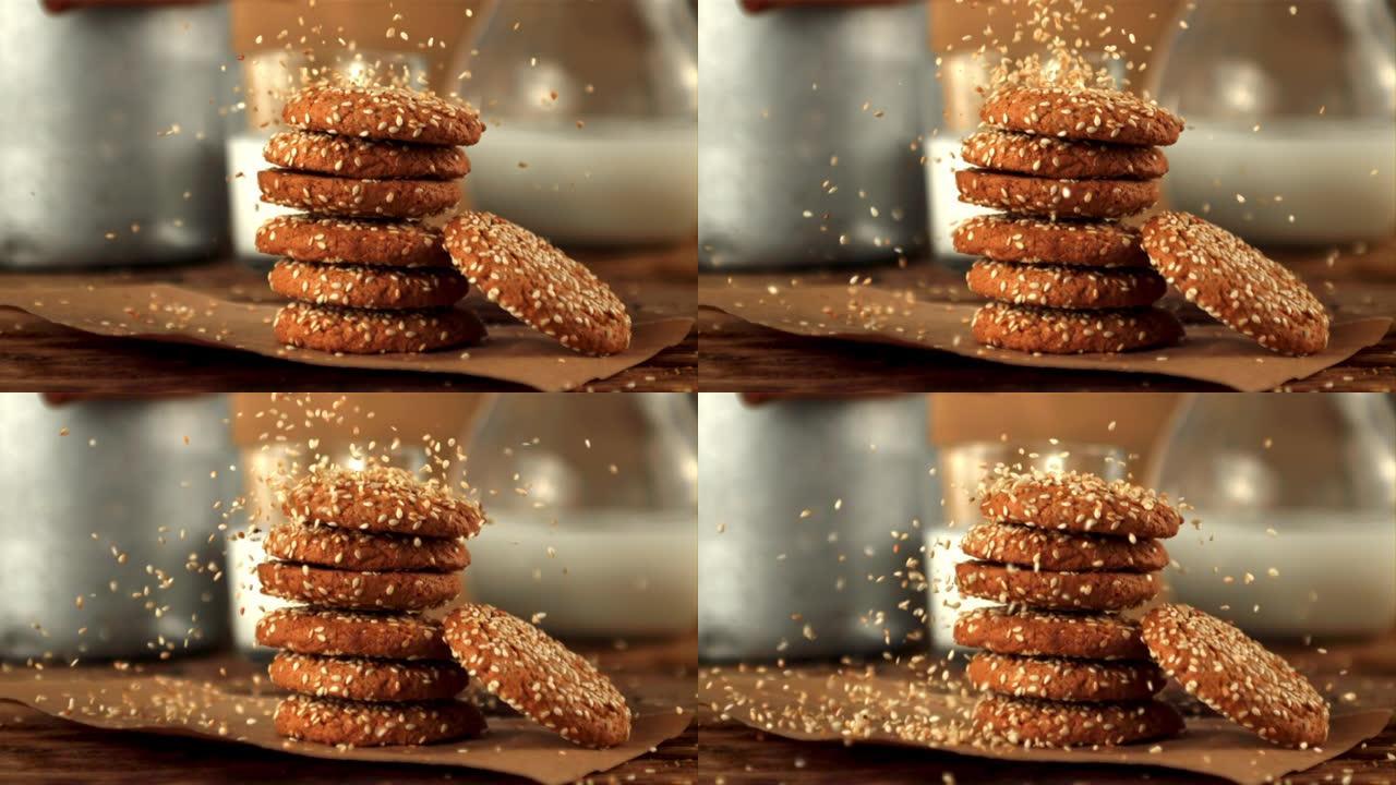 在纸上的燕麦饼干上的超级慢动作掉落芝麻。在1000 fps的高速相机上拍摄。