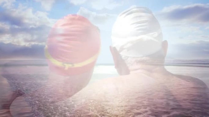 海边快乐的高级夫妇戴着游泳帽的发光动画