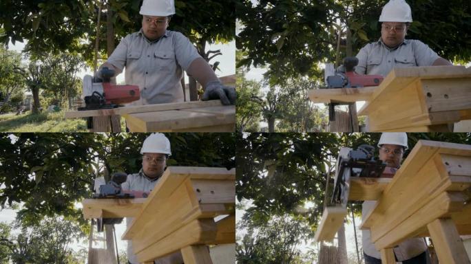 木匠在后院用圆锯切割木材