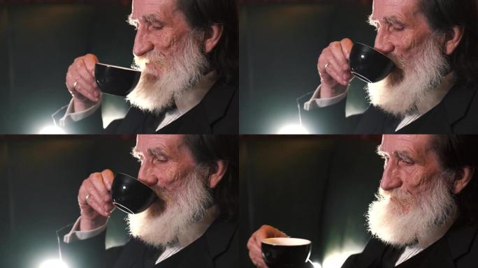 留着胡子的成熟男人独自喝杯咖啡