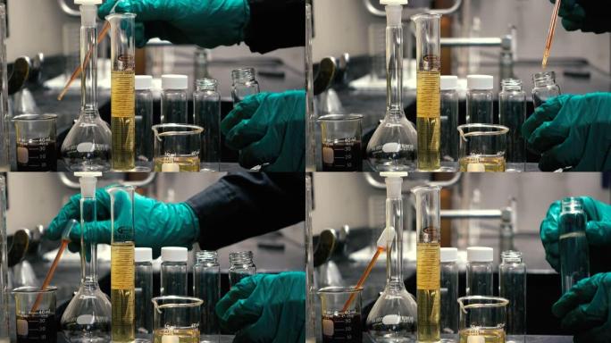 化学家在实验室实验中混合化学物质进行实验室测试，以发现试管中的颗粒含量或溶液。化学和石油概念