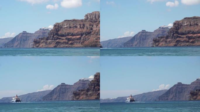 蓝星渡轮沿着希腊的圣托里尼岛航行。菲拉、伊莫洛维格利与斯卡罗斯岩石的景色