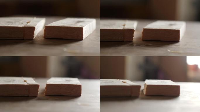 松木板没有沿着胶合的接缝分成两半。自制木胶。木材用明胶胶