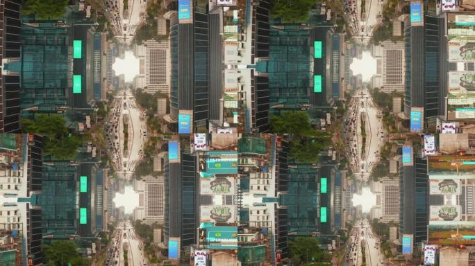 市区街道的向后显示，周围是高楼摩天大楼峡谷，带有大屏幕广告。繁忙的多车道道路。抽象镜像效果镜头。印度
