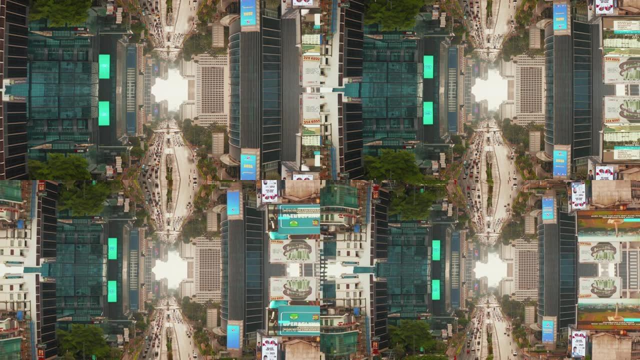 市区街道的向后显示，周围是高楼摩天大楼峡谷，带有大屏幕广告。繁忙的多车道道路。抽象镜像效果镜头。印度