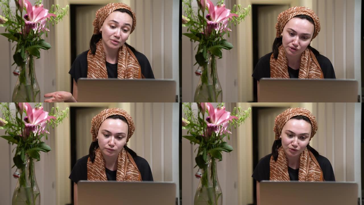 中东妇女戴着头巾进行视频通话