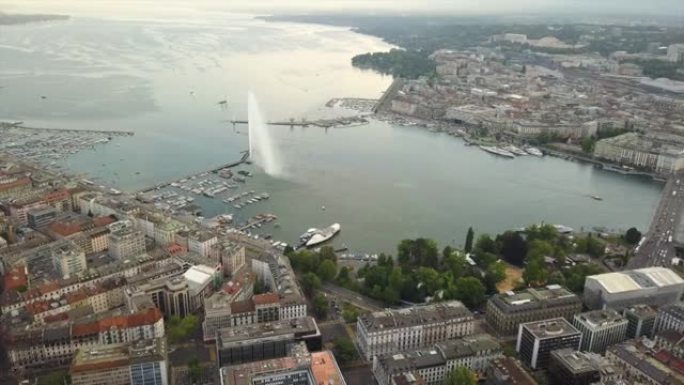 瑞士日落时间日内瓦城市景观湖边喷泉湾高空中全景4k