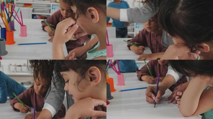 老师和孩子们画画的特写。