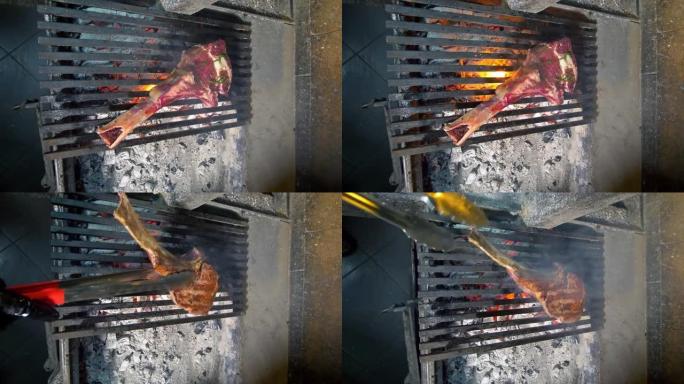 垂直视频。一位特写厨师将战斧牛排扔到火上。用煤在热烤架上烤一块多汁的牛排和香料和香草。高级美食餐厅。