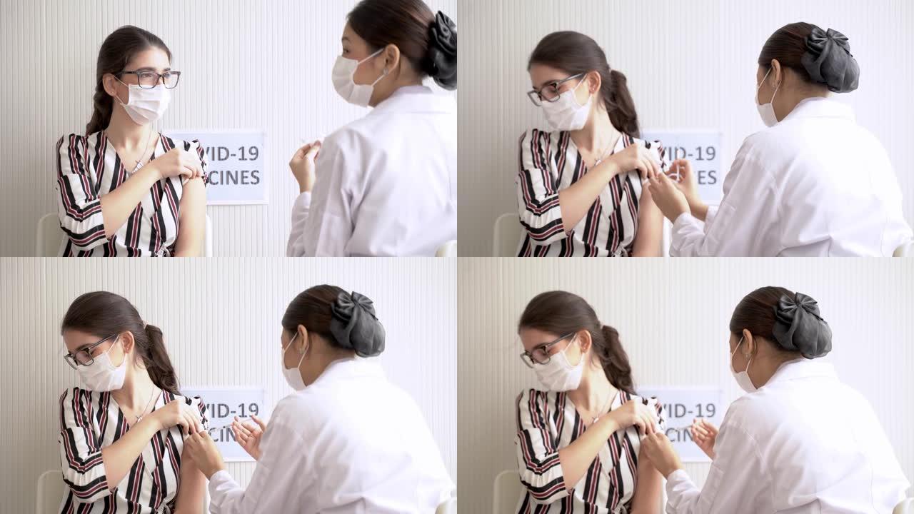 妇女在诊所或医院接种covid疫苗，手持护士注射疫苗以获得免疫力以保护病毒的肖像。戴着防护面具的少年
