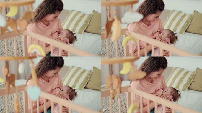 有爱心的妈妈在睡觉前母乳喂养婴儿
