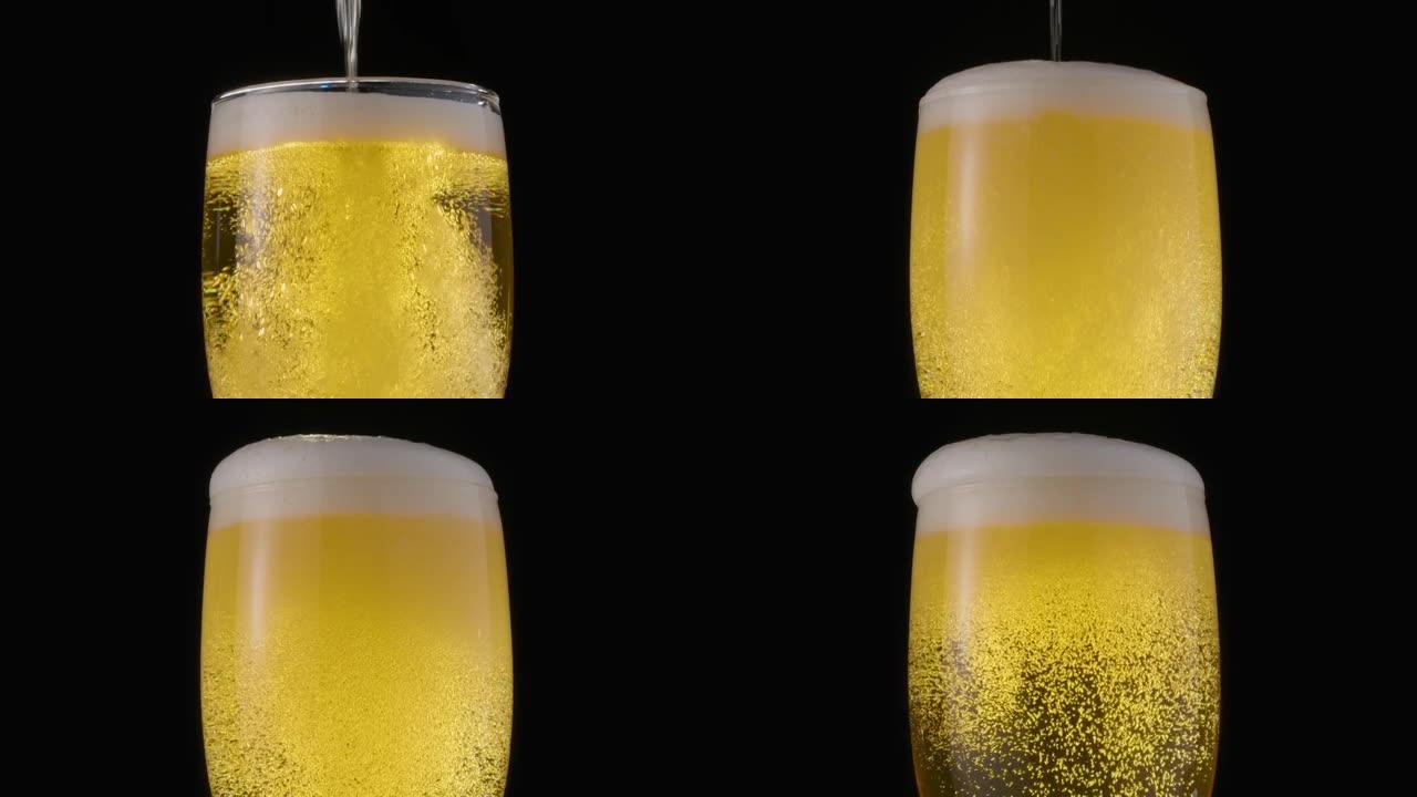 黑色背景上的一杯淡啤酒。气泡和泡沫慢慢爬到啤酒杯的顶部。顺时针旋转。