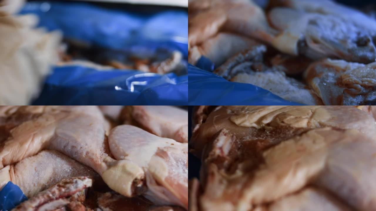 手套打开装满冷冻鸡腿的盒子的宏观视图。用冰覆盖的冷冻生鸡肉。4k视频