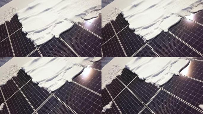 冬天，房子屋顶上的特写表面覆盖着太阳能电池板，上面有雪。