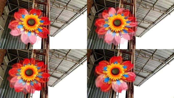 向日葵形状的玩具风车。概念替代能源。