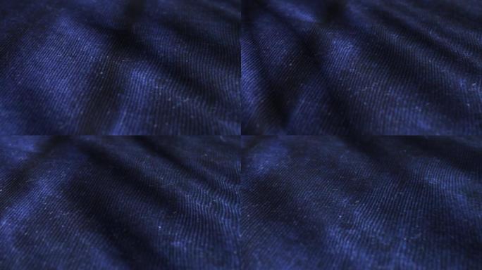 深蓝色天鹅绒表面背景。天鹅绒丝绒的详细宏观拍摄。