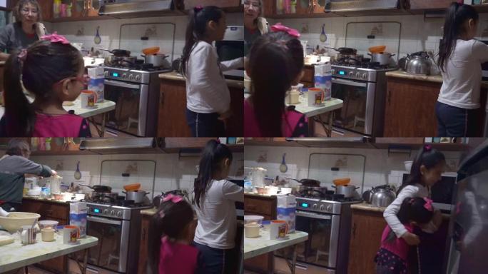 一个小女孩要在4k的厨房里拥抱她的堂兄过生日