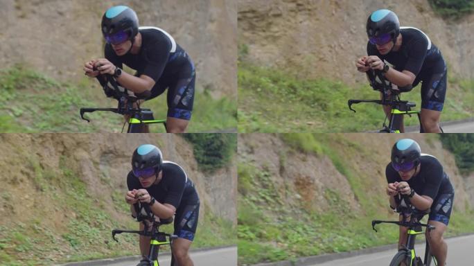铁人三项运动员运动员骑自行车的特写镜头。