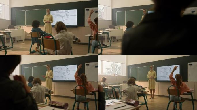 老师给孩子们讲解课。在小学学习的学生
