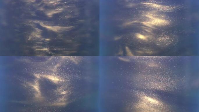 蓝色闪亮的银色颗粒心不在焉地向不同方向散射。