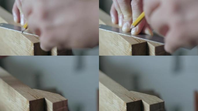 木匠用尺子和铅笔在木板上做标记。木工艺术。手工木工工具的声音