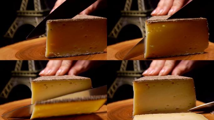 刀的特写在木板上切一小块硬奶酪