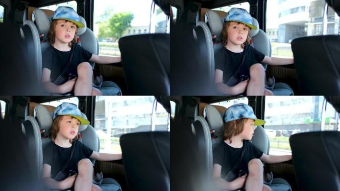 快乐的小男孩坐在行驶中的车窗附近