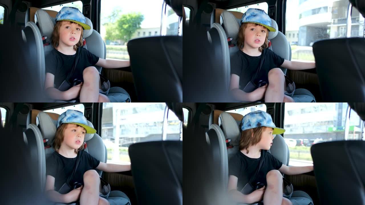 快乐的小男孩坐在行驶中的车窗附近