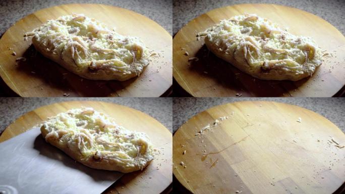 用章鱼烹饪平萨罗马纳的过程。厨师拿海鲜品纳在烤箱里烘烤。Scrocchiarella。意大利美食。