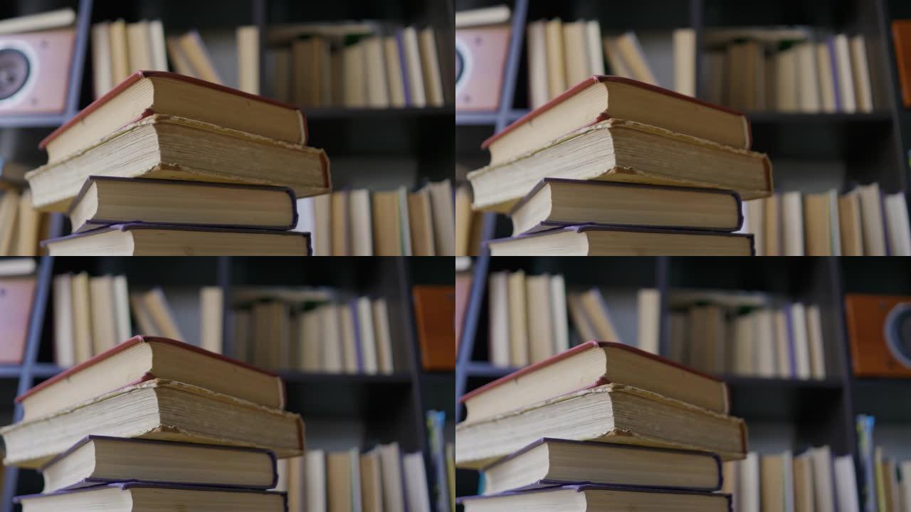 Steadicam镜头，4K。相机在书架附近堆积的书籍周围移动