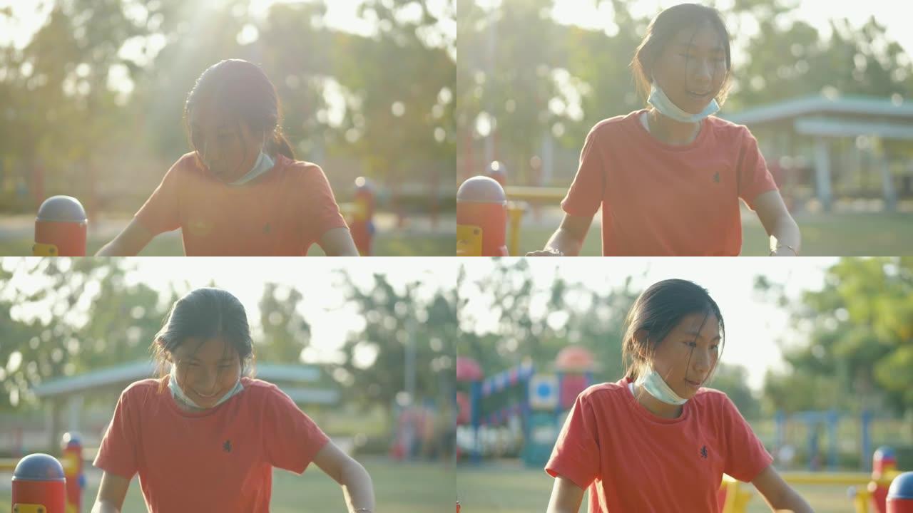 亚洲儿童在户外用太阳灯运动器材锻炼，生活方式理念。