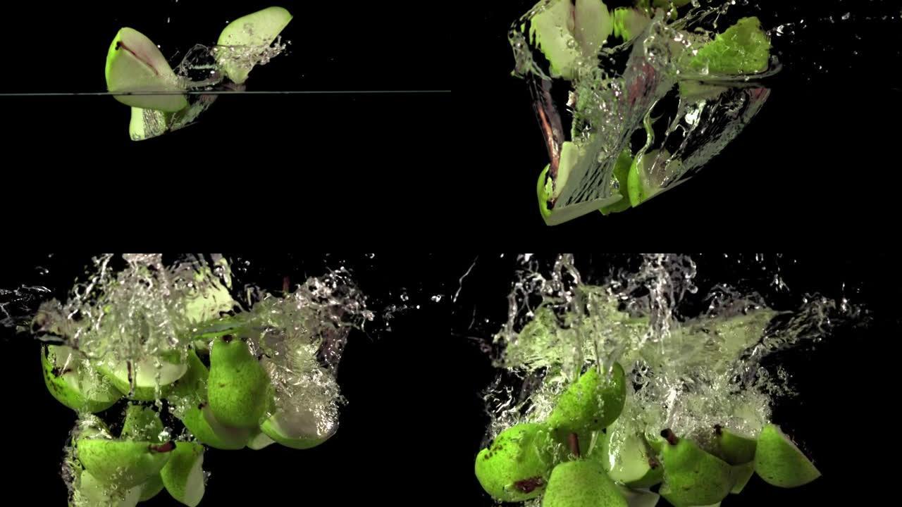 超级慢动作的梨片带着气泡落在水下。以1000 fps的高速相机拍摄。