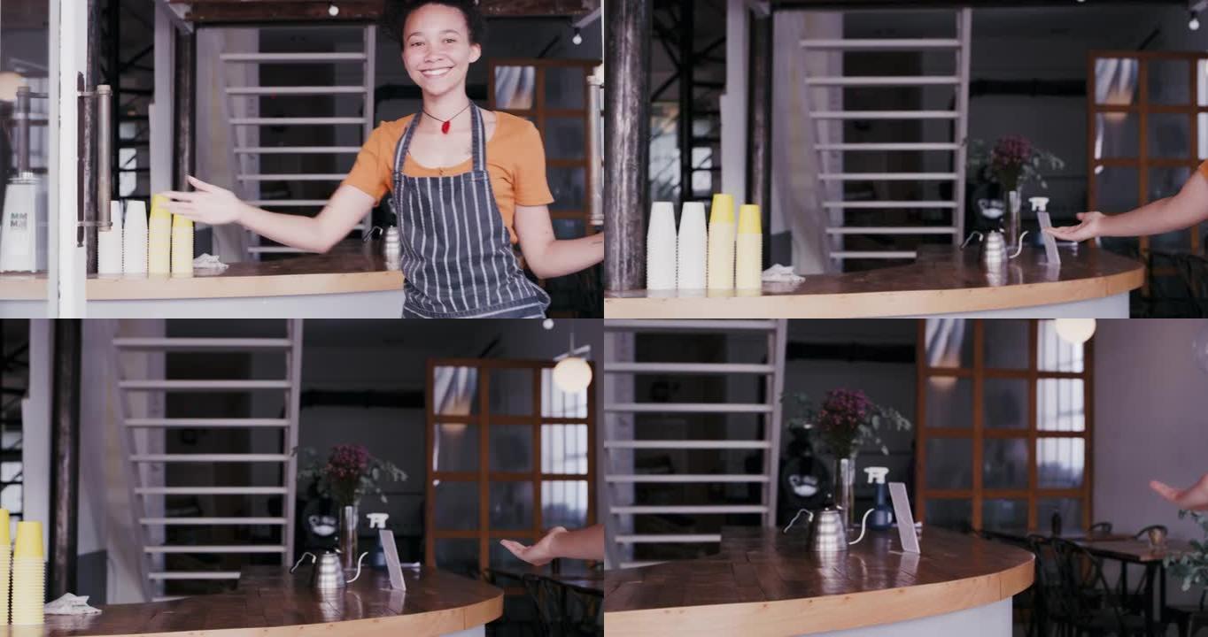 4k视频片段，一位迷人的年轻咖啡师以热情的方式打开了咖啡馆的门