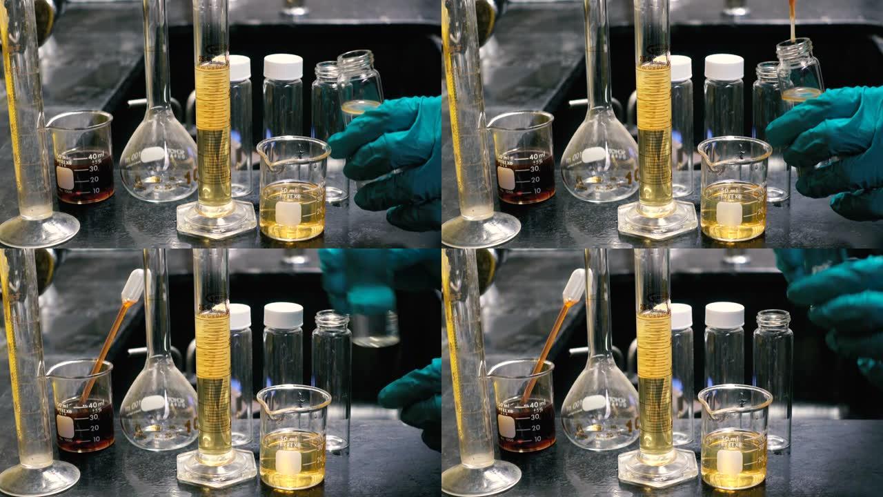 化学家在实验室实验中混合化学物质进行实验室测试，以发现试管中的颗粒含量或溶液。化学和石油概念