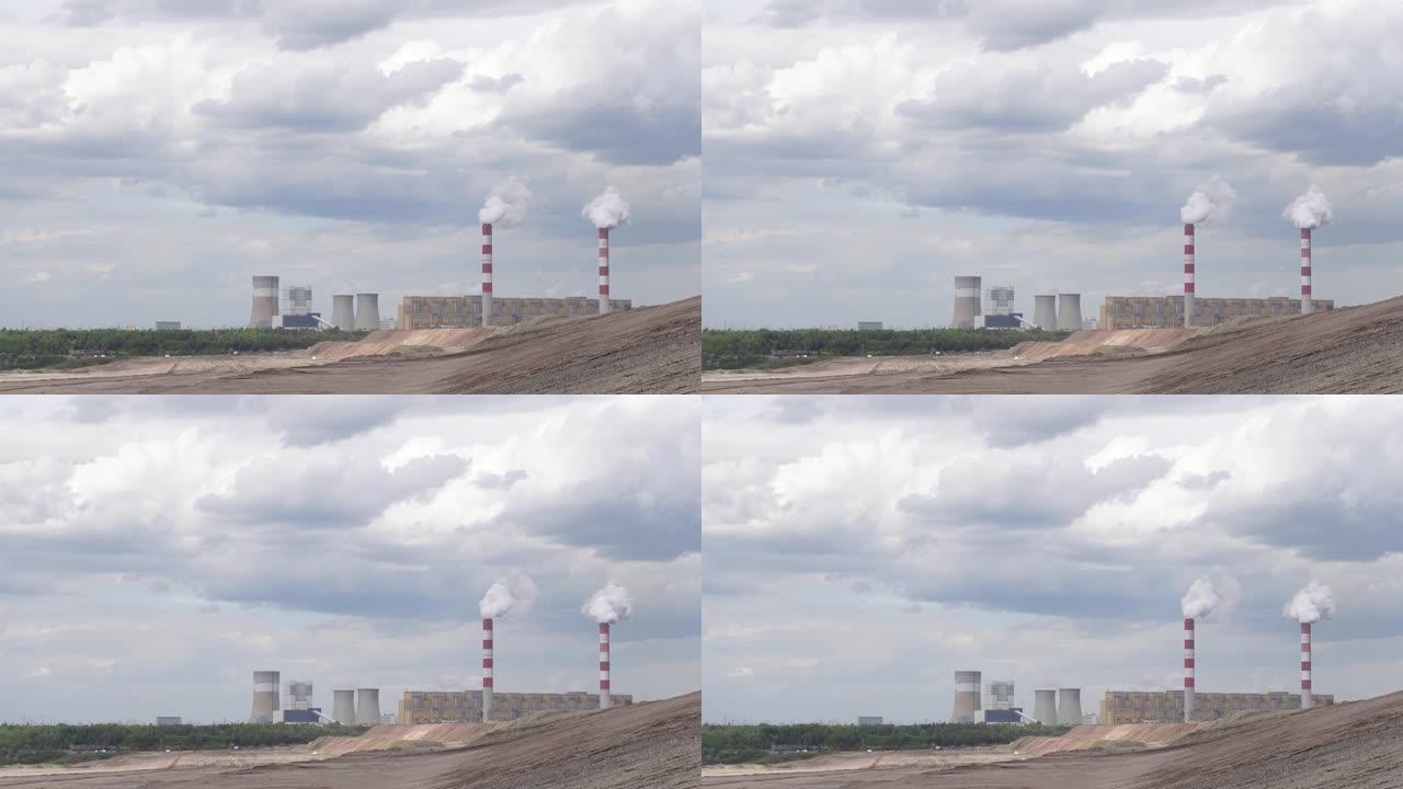 一个带有吸烟烟囱的燃煤发电厂的稳定视图。
